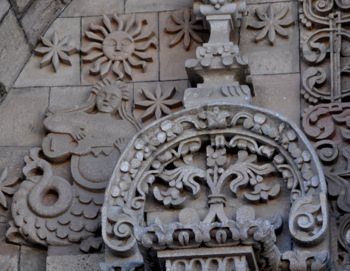 Sirens playing the guitar with the Sun God in a church facade